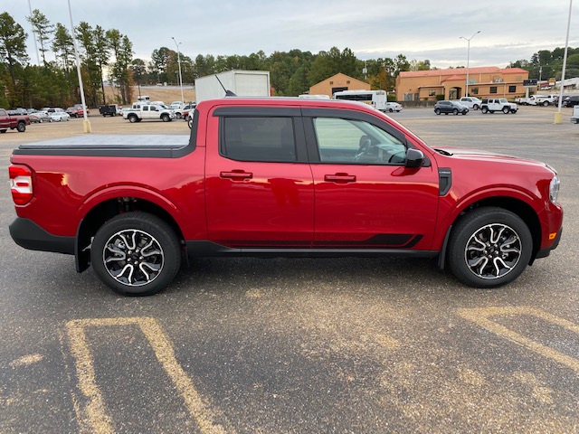 Passenger side of a 2022 red Ford Maverick. pickup truck.