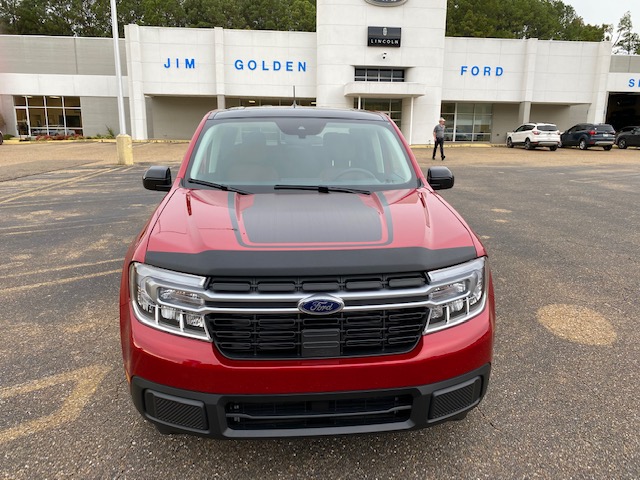 Front view of 2022 Maverick with hood decals in front of Jim Golden Ford Lincoln in Camden Arkansas.